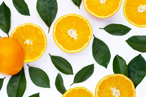 stock image Orange fruit with green leaves on white background.