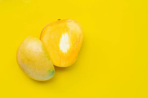 stock image Tropical fruit, Mango on yellow background. Top view