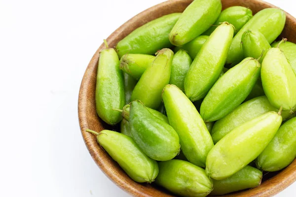 stock image Bilimbi fruit in bamboo basket on white background.