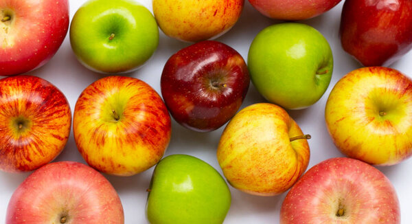 Various types of apples on white background.