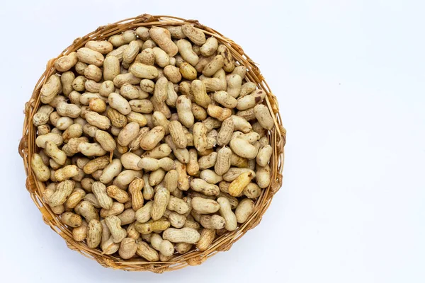 Raw peanuts on white background.