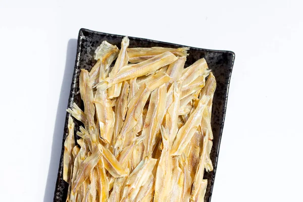 Dried anchovy on white background.