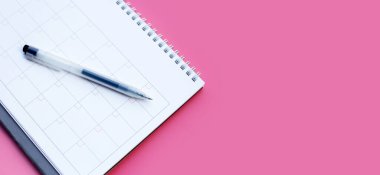 Calendar with pen. Copy space