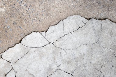 Arka plan için çatlamış çimento ya da beton yüzey dokusu.