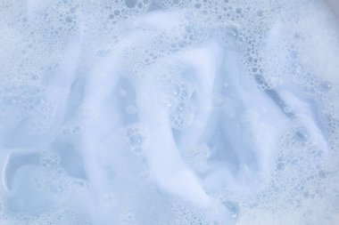 Top view of towel soak in powder detergent water dissolution. Laundry concept