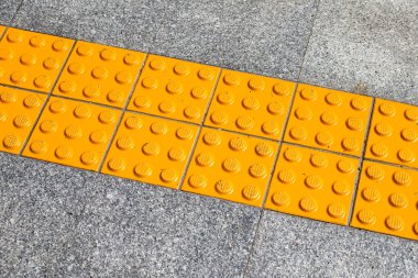 Yellow blind floor on walkway