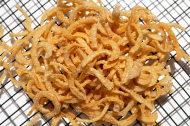 Crispy pork rinds or pork snack.