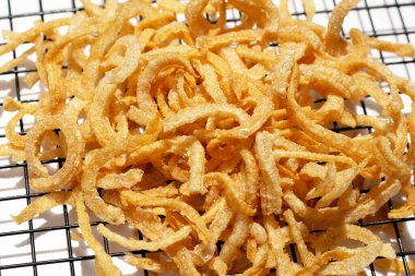 Crispy pork rinds or pork snack.