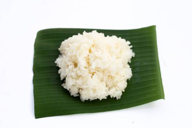 Sticky rice on banana leaf on white background.