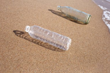 Plastic with glass bottle on the beach