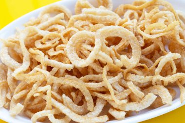 Crispy pork rinds or pork snack.