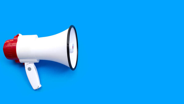 Red and white megaphone on blue background.