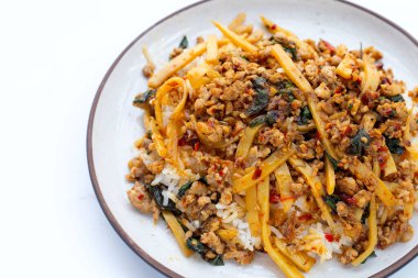 Rice with spicy stir fried pork with holy basil and preserved bamboo shoot