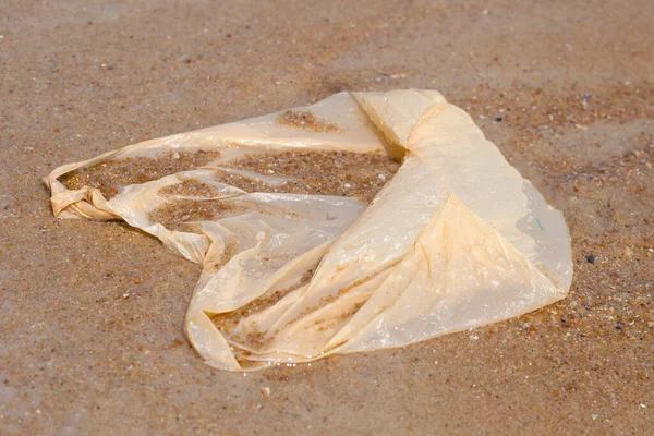 stock image Plastic bag pollution on the beach