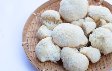 Fresh lion's mane mushroom on white background.