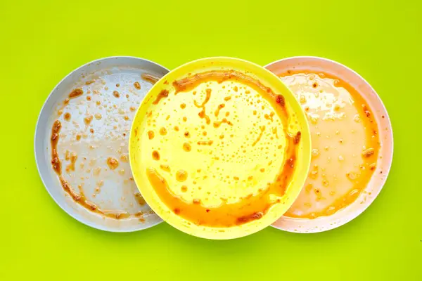 stock image Dirty dishes on green background. Top view