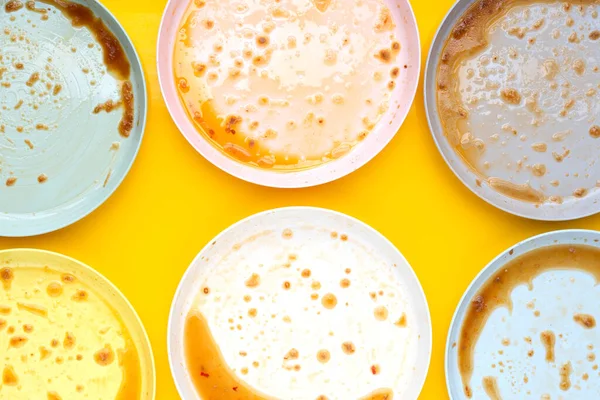 stock image Dirty dishes on yellow background. Top view