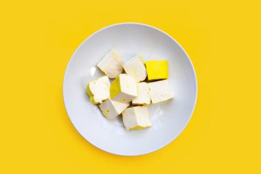 Yellow tofu on yellow background.