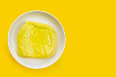 Yellow tofu on yellow background.