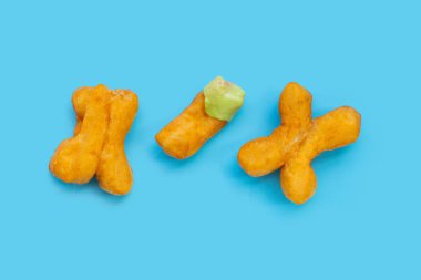 Deep-fried dough sticks or chinese bread sticks with with pandan custard dip