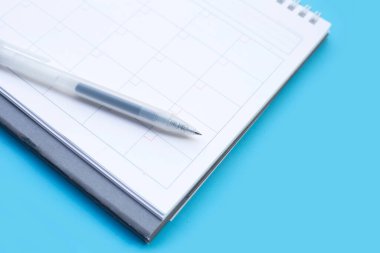 Calendar with pen. Copy space