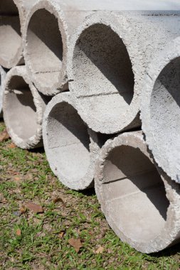 Grey concrete pipe for the construction