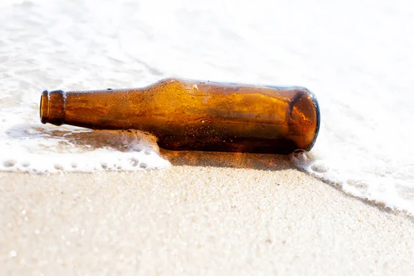 stock image Glass bottle on the beach