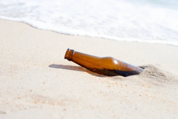 stock image Glass bottle on the beach