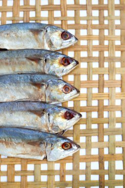 Salted fish on bamboo weave plate