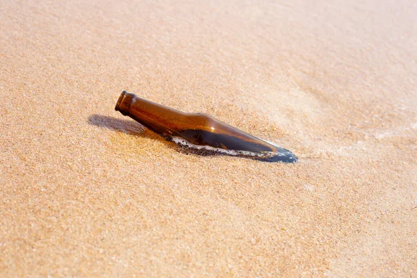 stock image Glass bottle on the beach