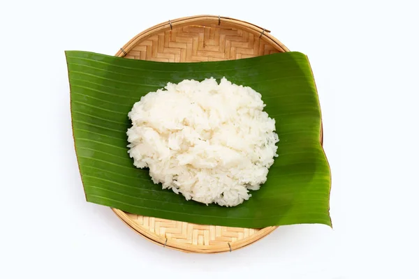 stock image Sticky rice on banana leaf in bamboo weave plate on white background. 