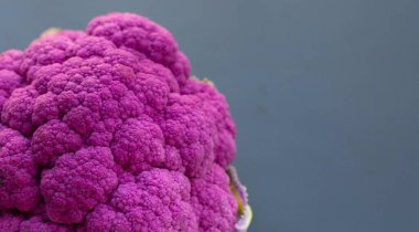 Purple cauliflower on dark background.