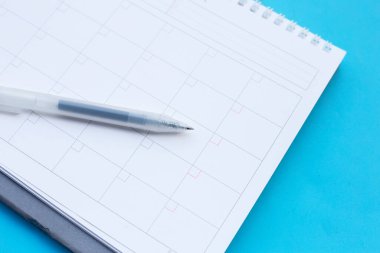 Calendar with pen. Copy space