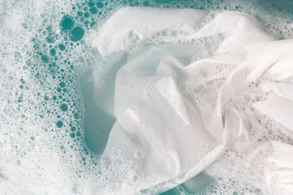 stock image Soak a cloth before washing, white cloth