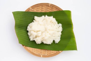 Sticky rice on banana leaf on white background.