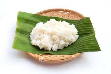 Sticky rice on banana leaf on white background.
