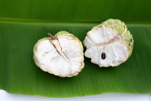 stock image Custard apple fruit on banana leaf