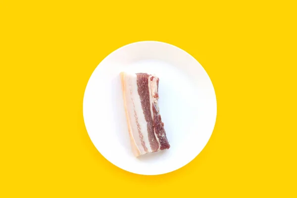 Streaky Pork White Plate Yellow Background — Stock Photo, Image