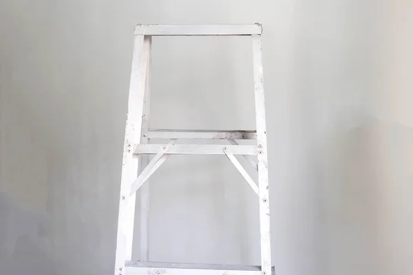 Old aluminum ladder. Home repair