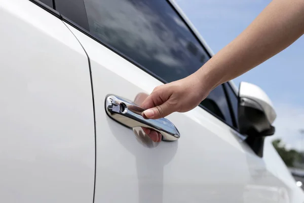 Male hand opening car door