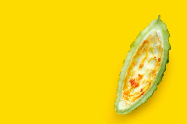 Bitter melon on yellow background.