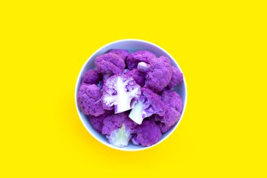 Purple cauliflower on yellow background.