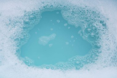 Detergent foam bubble on water. Blue background, Soap sud clipart