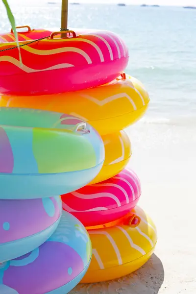 Inflatable rings on the beach. Summer concept