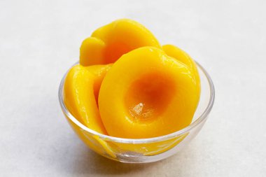 Peach halves in syrup. Fruity desserts clipart