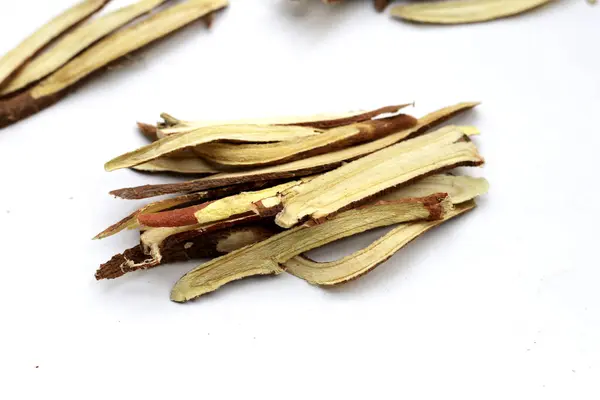 Stock image Liquorice sliced on white background.