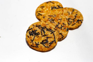 Japanese rice crackers with nori seaweed clipart