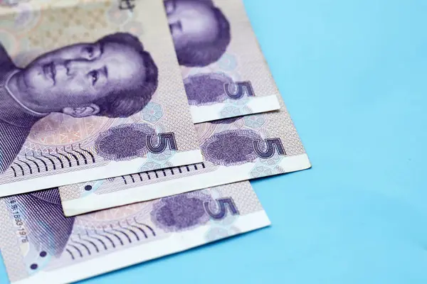 stock image Chinese money, Yuan banknotes on blue background.