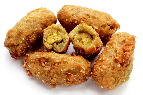 stock image Deep-fried banana rolls with unripe rice grain