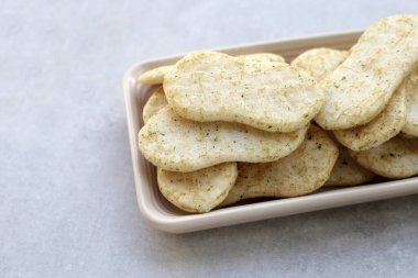 Japanese rice crackers with nori seaweed clipart